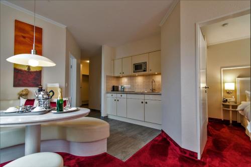 Kuchyň nebo kuchyňský kout v ubytování Suiten-Hotel mare Langeoog