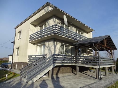 a building with a gazebo in front of it at Villa Sanriver in Przemyśl