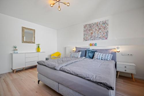 Ένα ή περισσότερα κρεβάτια σε δωμάτιο στο Ferienhaus Apfelblüte by Heinke Wohnraum
