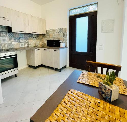 a kitchen with a table and a counter top at L'Orto di Grace in Sorrento