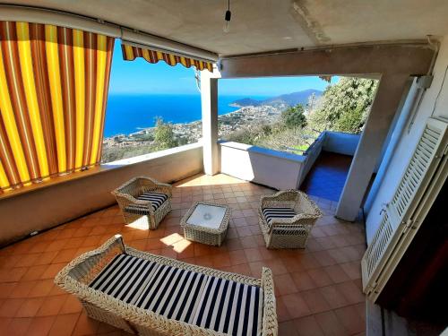 a balcony with chairs and a view of the ocean at Da Alfonsina in Castellabate