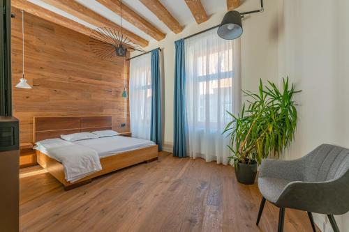 Un pat sau paturi într-o cameră la premium suites Postavarului