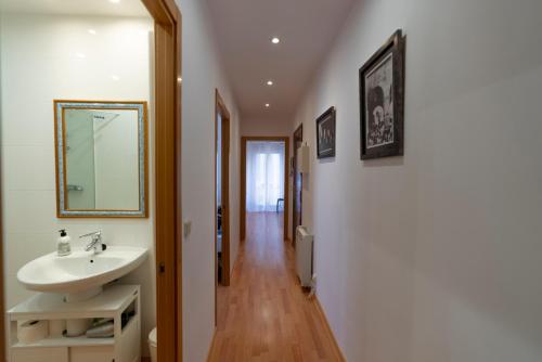 a bathroom with a sink and a mirror at Herradores Centro in Soria