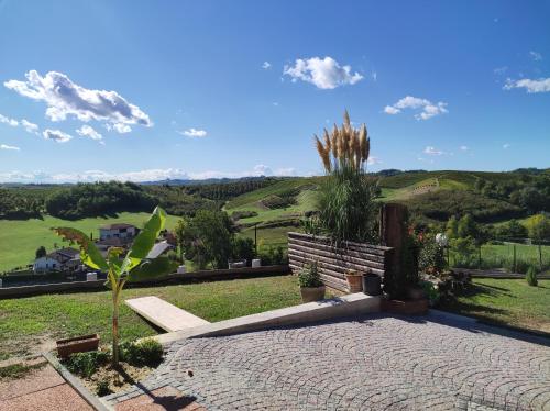 a stone patio with a view of a mountain at Helix 1912 in Bric Gallo