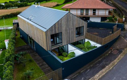 an overhead view of a house with a garden at FURNAS HOUSES in Furnas