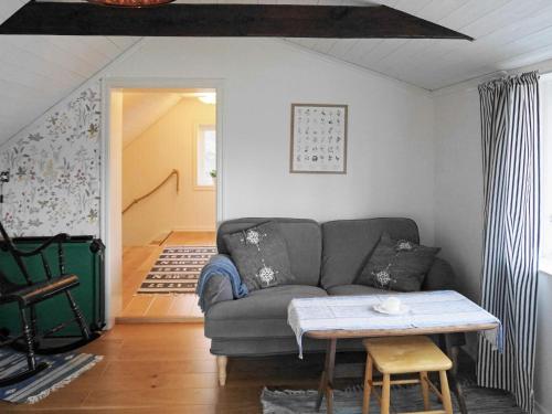 a living room with a couch and a table at 6 person holiday home in Höviksnäs-By Traum in Höviksnäs