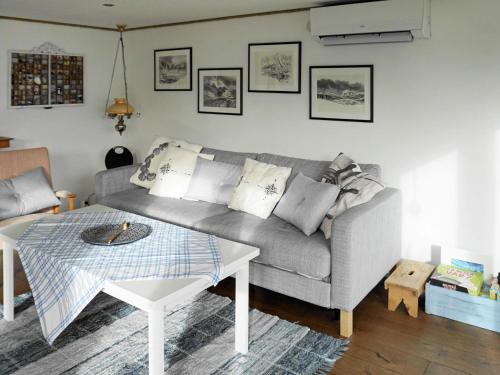 a living room with a couch and a table at 6 person holiday home in Höviksnäs-By Traum in Höviksnäs