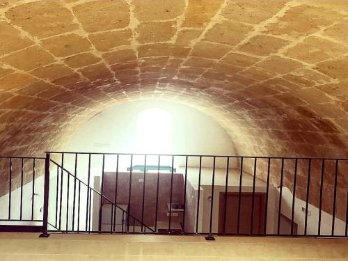 a tunnel with a staircase in a building at La casa del nonno in Matera
