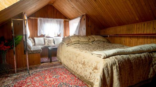 a bedroom with a bed in a wooden room at Semaldi Orient in Sarajevo