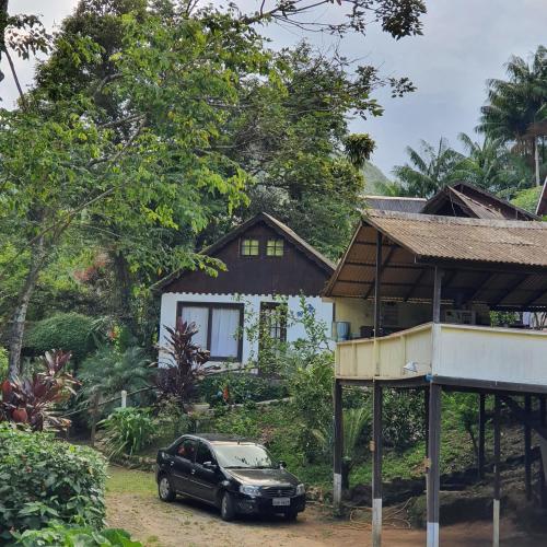 Taman di luar Chalés Lumiar - Casas temporada