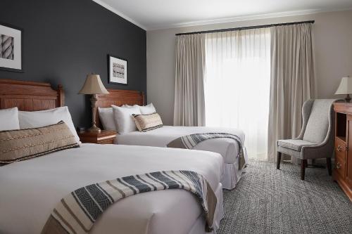 a hotel room with two beds and a window at The Federal in Brunswick