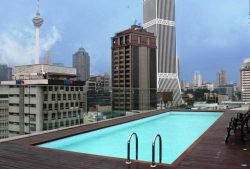 a large swimming pool on the roof of a building at Pacific Express Hotel Central Market Kuala Lumpur in Kuala Lumpur