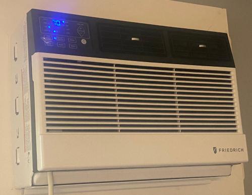 a white microwave oven with a blue light on it at Perfect for families and couples - Maui Sunset A-203 in Kihei