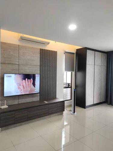 a living room with a flat screen tv on a wall at Urban360 Pool view with Netflix and wifi in Batu Caves