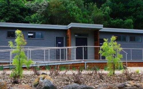 a mobile home with a porch and a porch at BIG4 Wye River Holiday Park in Wye River