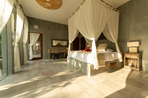 Letto o letti in una camera di Tanah Damai Hotel