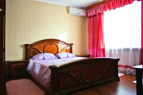Un ou plusieurs lits dans un hébergement de l'établissement Alliance Apartments at Teatralniy