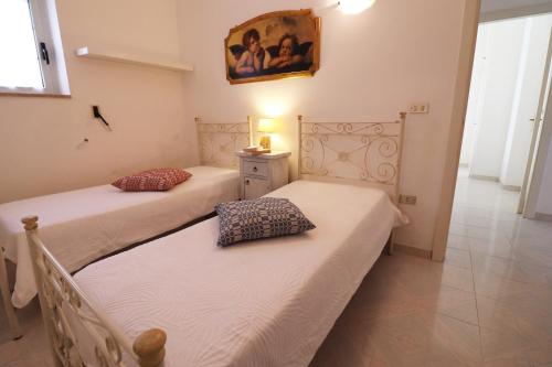 En eller flere senge i et værelse på Casa Primus Torre Santo Stefano in Otranto