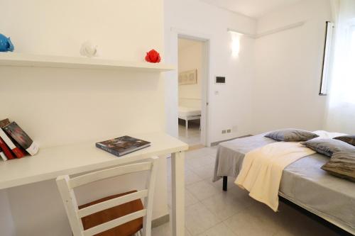 Ένα ή περισσότερα κρεβάτια σε δωμάτιο στο Casa Nero Davola Residence Torre Santo Stefano in Otranto