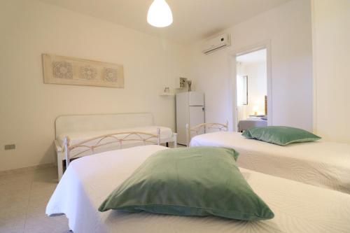Ένα ή περισσότερα κρεβάτια σε δωμάτιο στο Casa Nero Davola Residence Torre Santo Stefano in Otranto