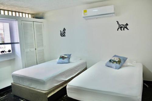 Postel nebo postele na pokoji v ubytování Casa del Gato