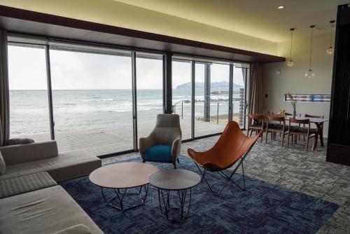 a living room with a view of the ocean at Sinori205 in Hakodate