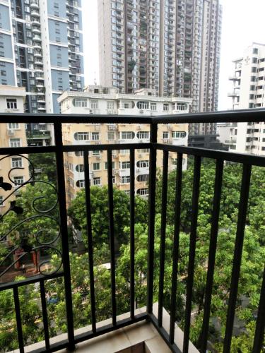 a balcony with a view of the city at YuMi Gaopai in Guangzhou