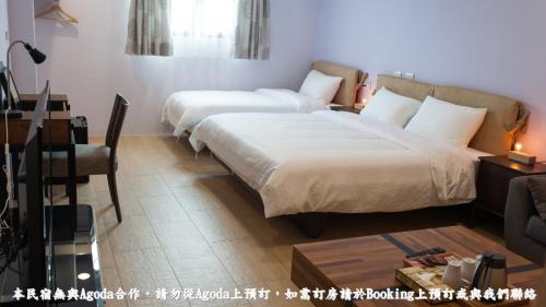 Cama o camas de una habitación en 河岸香榭&田苑民宿