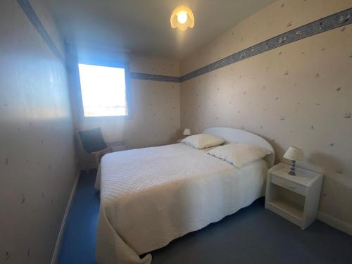 Ein Bett oder Betten in einem Zimmer der Unterkunft L Horizon vue mer