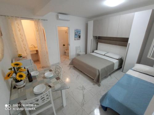 Postel nebo postele na pokoji v ubytování Mamalina Residence