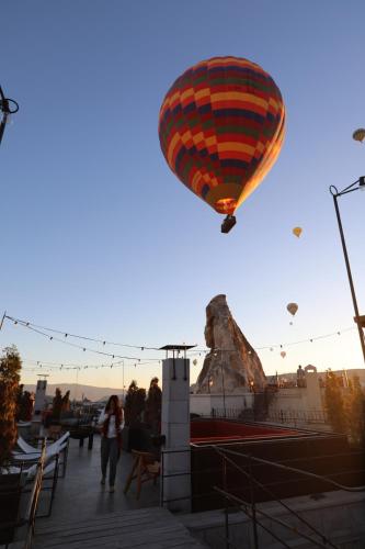 a hot air balloon flying in the sky at Carus Cappadocia in Goreme