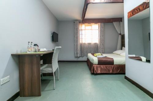 Postel nebo postele na pokoji v ubytování Kings Premier Inn