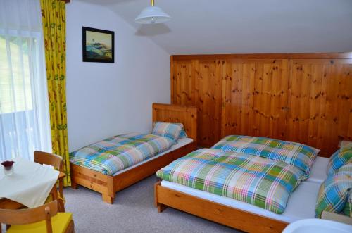 Postel nebo postele na pokoji v ubytování Haus Dachstein Schnitzer