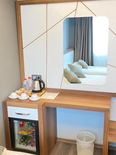 Una cama o camas en una habitación de Hakcan Hotel