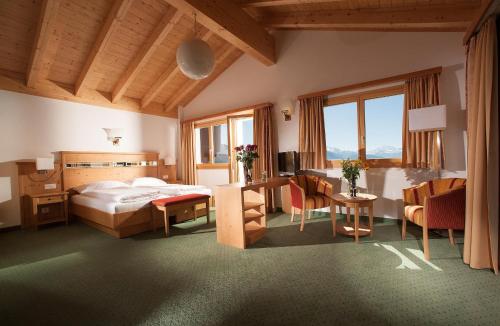 Postel nebo postele na pokoji v ubytování Hotel Aletsch