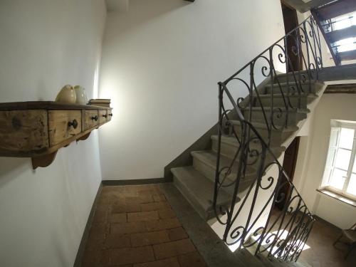 a staircase in a house with a window at Casa Locci in Capannori