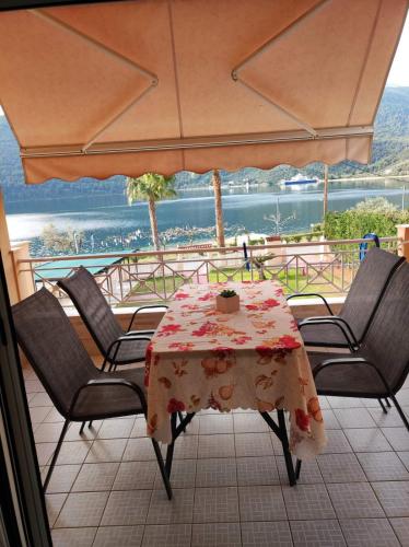 a table and chairs with a tablecloth on a table at Bella Vista in Yiáltra