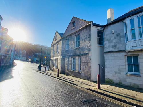 an empty street in an old town with buildings at The Old Rope House in Portland