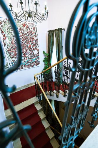 a set of stairs with a chandelier at Hotel Elch in Nuremberg