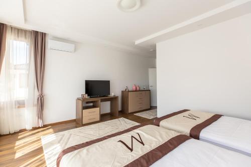 Postel nebo postele na pokoji v ubytování Malak Resort Sarajevo
