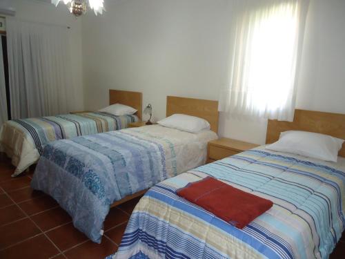 Cama o camas de una habitación en Alojamento Poço do Barro