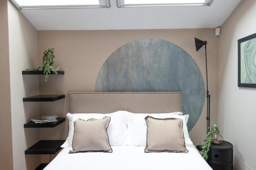 Ένα ή περισσότερα κρεβάτια σε δωμάτιο στο Petra Apuana Luxury Apartment