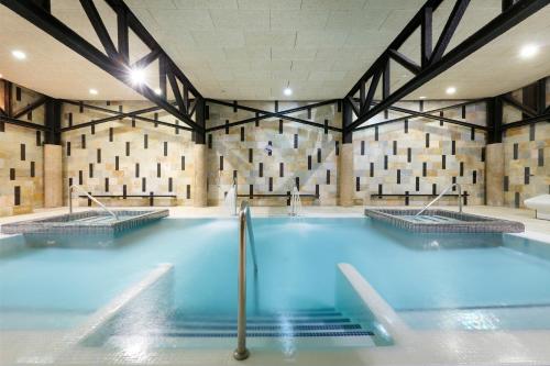 a large swimming pool in a building at Eurostars Las Salinas in Caleta De Fuste