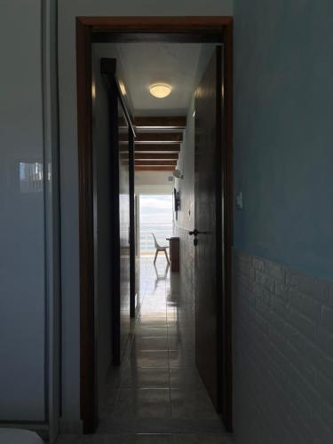 a hallway with a door leading to a room at Skizenas Waterfront Apartments in Haraki