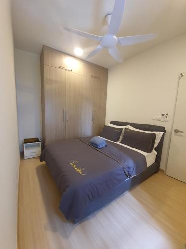 a bedroom with a bed with a ceiling fan at Wallaway2stay Gravit8 Klang 2Room in Klang