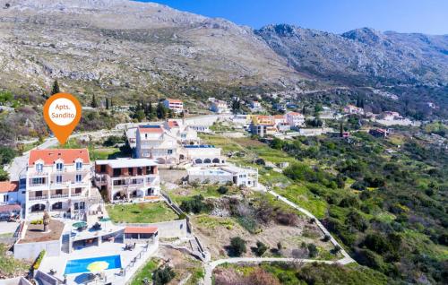 an aerial view of a town with an orange sign at Apartments Sandito in Mlini