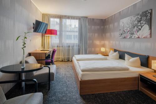 Voodi või voodid majutusasutuse Hotel Fidelio toas