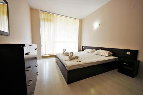 Posteľ alebo postele v izbe v ubytovaní Sunset Beach - Menada Apartments