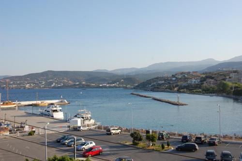 a large body of water with a bunch of cars at Atlantis Hotel in Agios Nikolaos