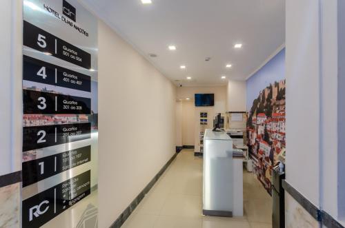 a pharmacy aisle with a sign on the wall at Hotel Duas Nações in Lisbon